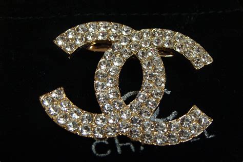 chanel gold rhinestone bow brooch|chanel costume jewelry.